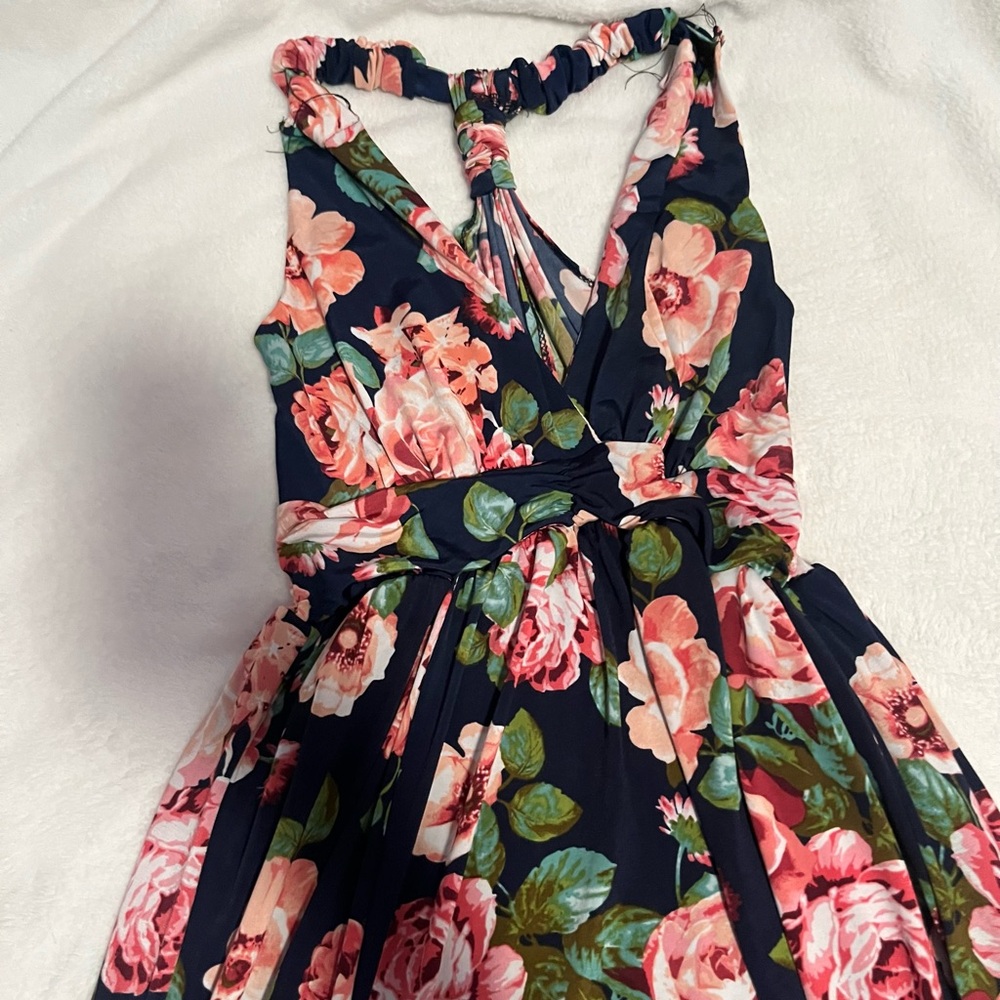 Beautiful floor length, strap floral dress with a slit on right leg.
